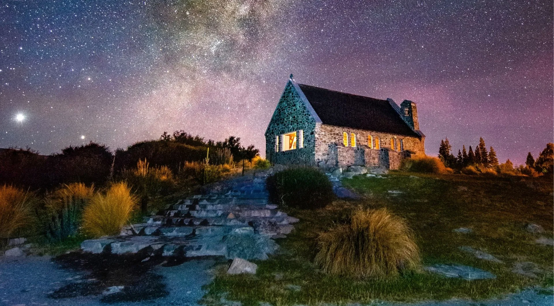 Church of the Good Shepherd beneath a star-filled night sky